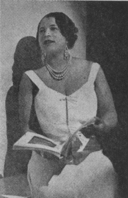 portrait of Caterina Jarboro looking up from her reading in a stunning white dress