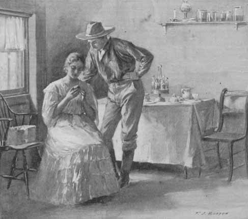 man in a stetson bending over a woman seated in a chair, looking at a stone