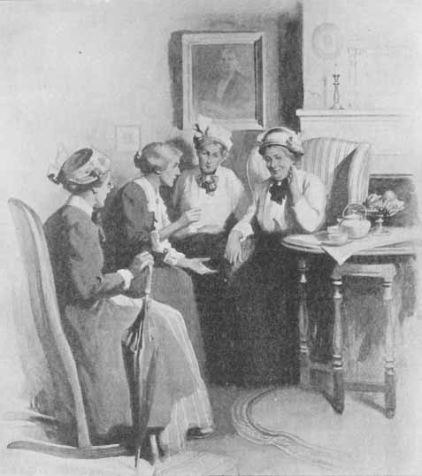 four older women seated by a tea table
