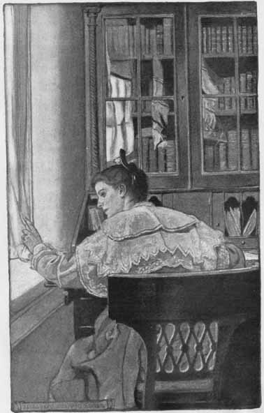 woman at a desk, looking out a window
