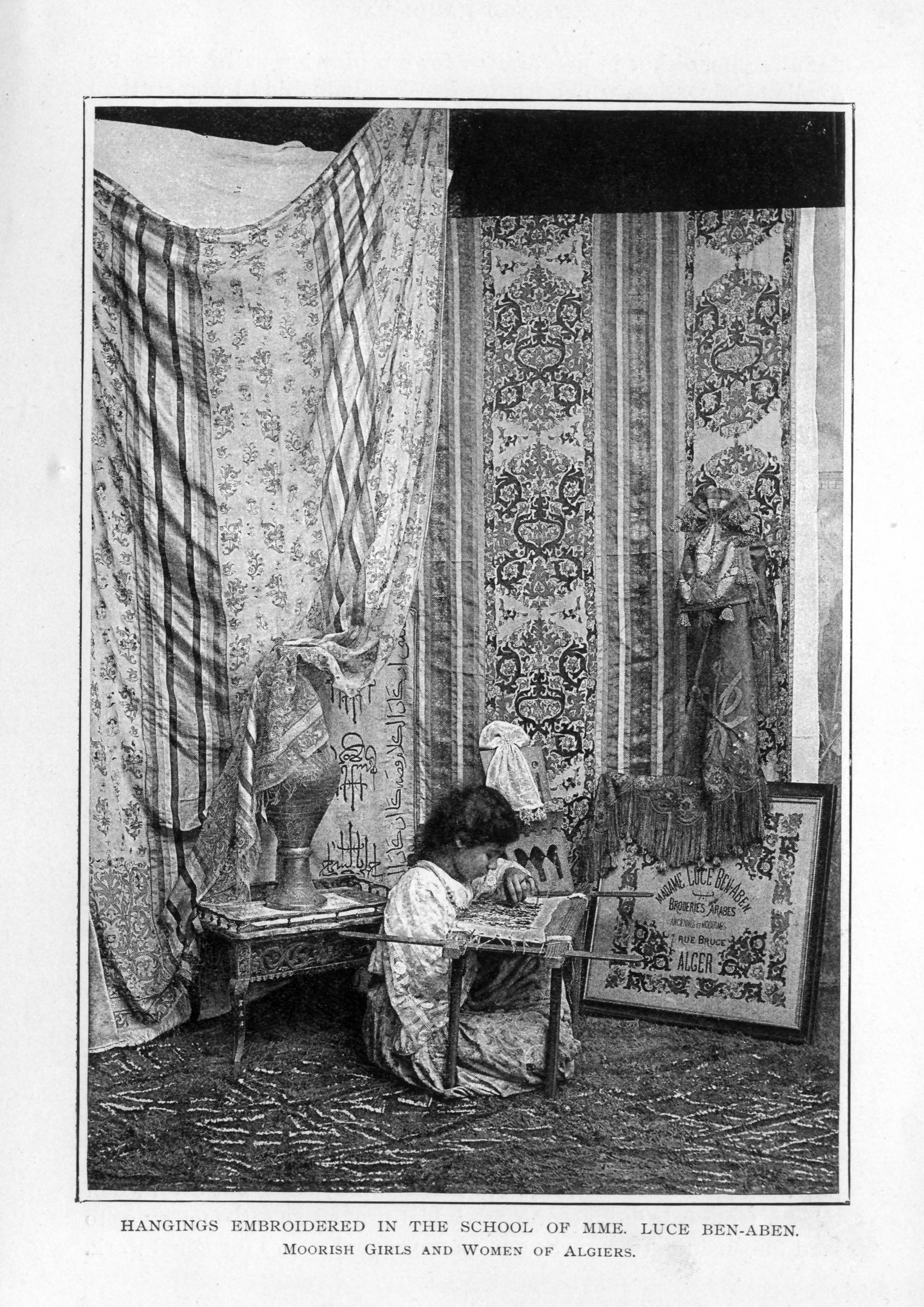 young girl embroidering in room hung with several draping embroidered panels