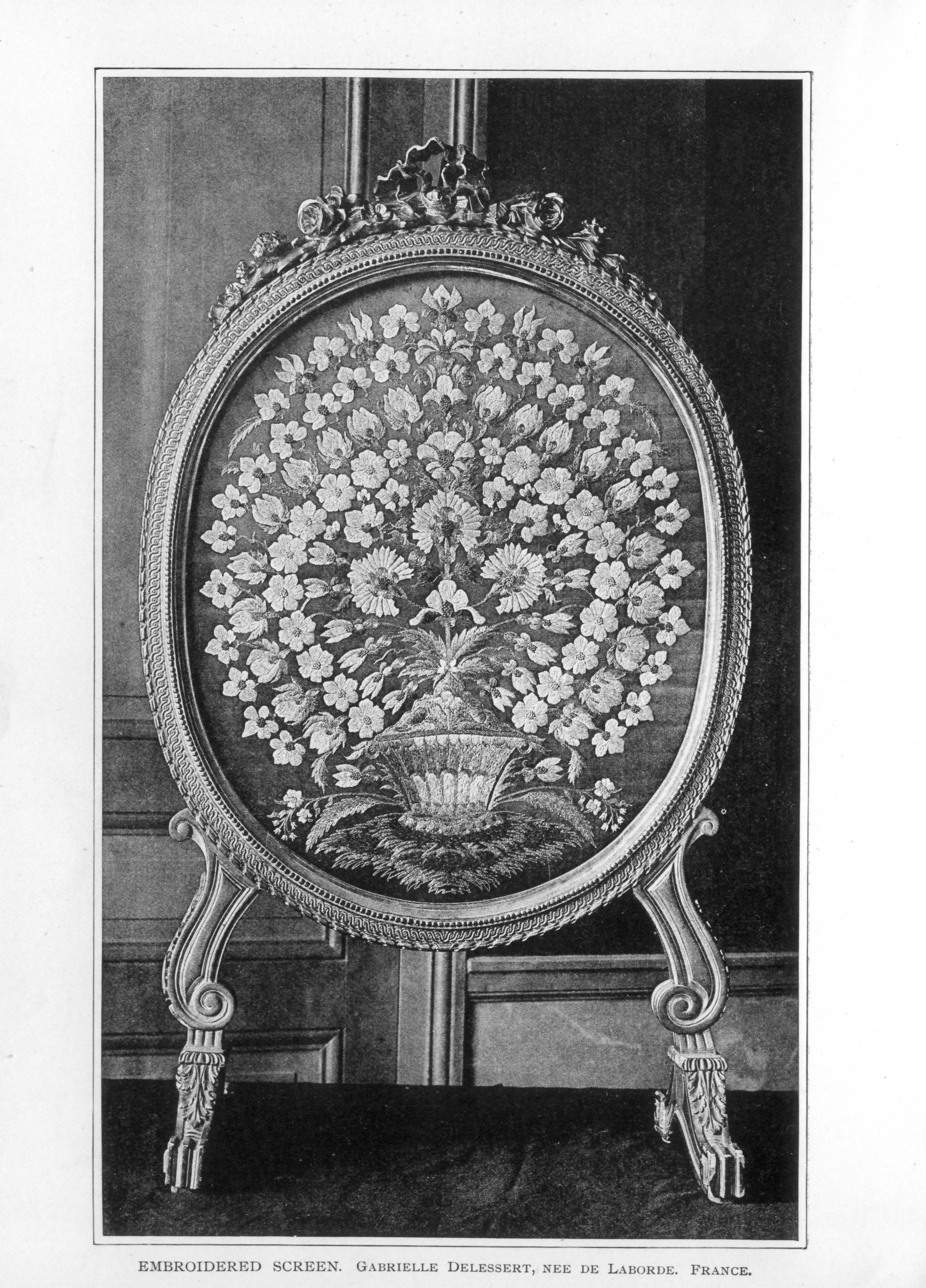 large oval screen decorated with intricate floral design