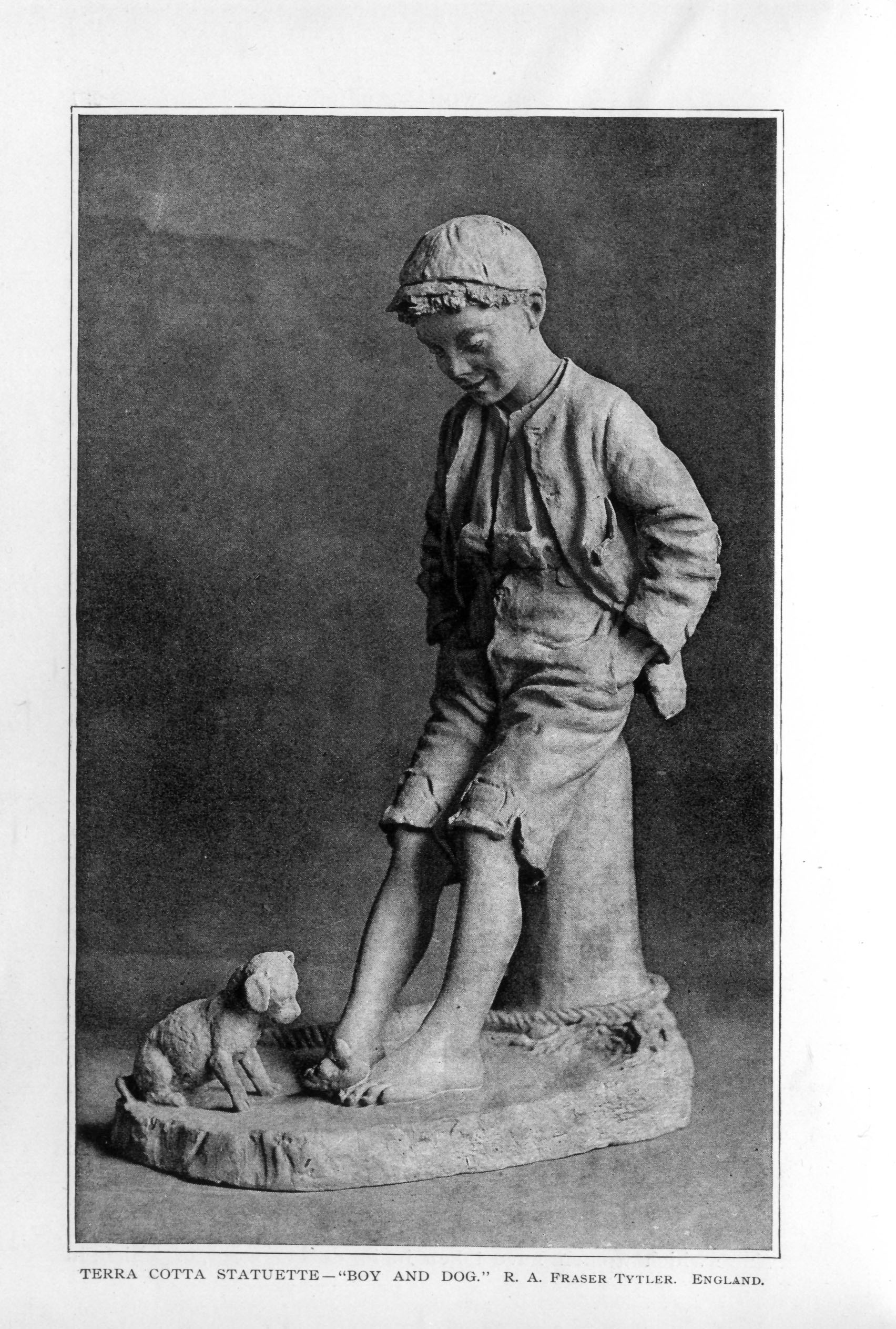 statue of a young boy sitting with a puppy