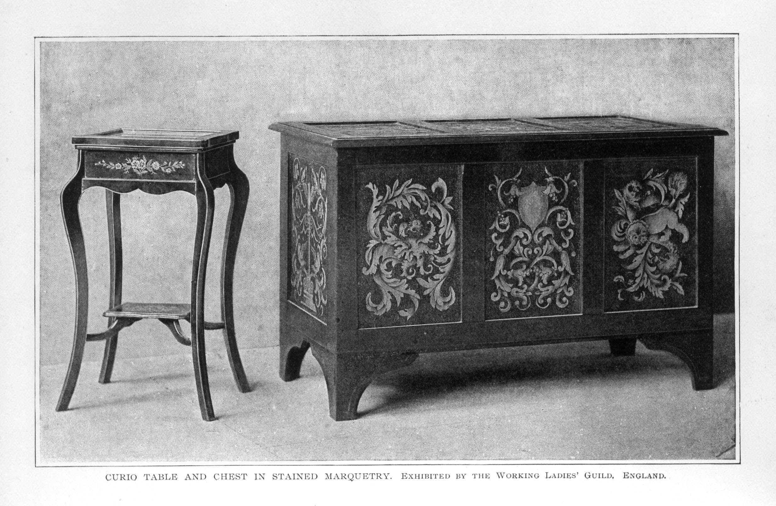 small table and cabinet decorated with floral and scrolling marquetry