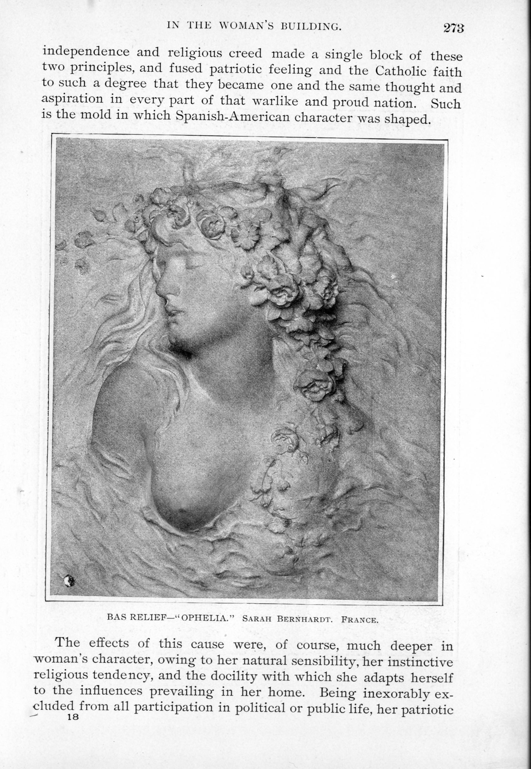 carved relief of woman with bare chest and flowers in her hair