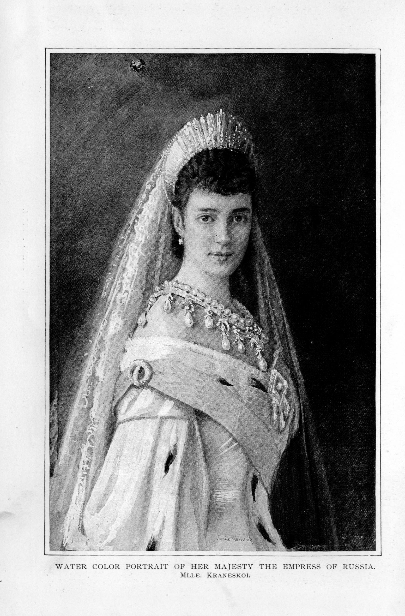 empress in royal dress with jeweled necklace and lace veil attached to her tiara