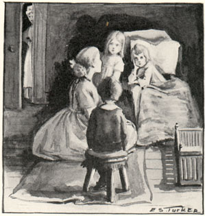 woman sitting on floor telling stories to three children at night as another woman peers through the door
