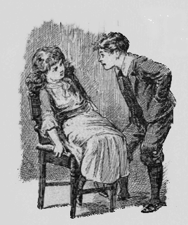 Boy hovering over seated girl. They are looking intently into each other's eyes.