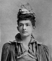 Photograph of woman in elaborate dress and hat