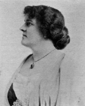 photograph of woman with necklace in profile