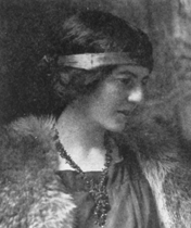 woman with headband and fur coat