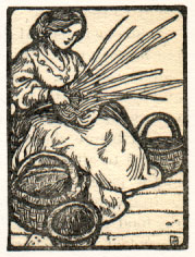 seated woman weaving baskets