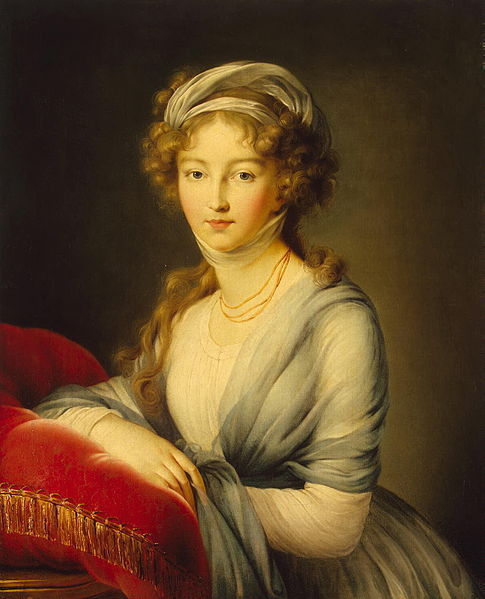 Portrait of a woman leaning on a cushion