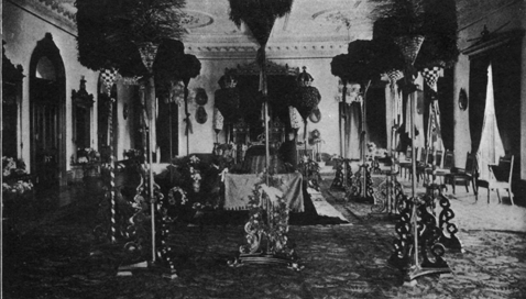 casket in the center of an ornate room