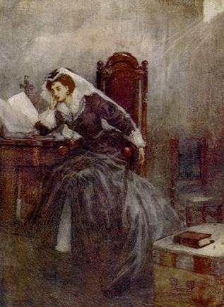 woman seated at desk resting head on her hand
