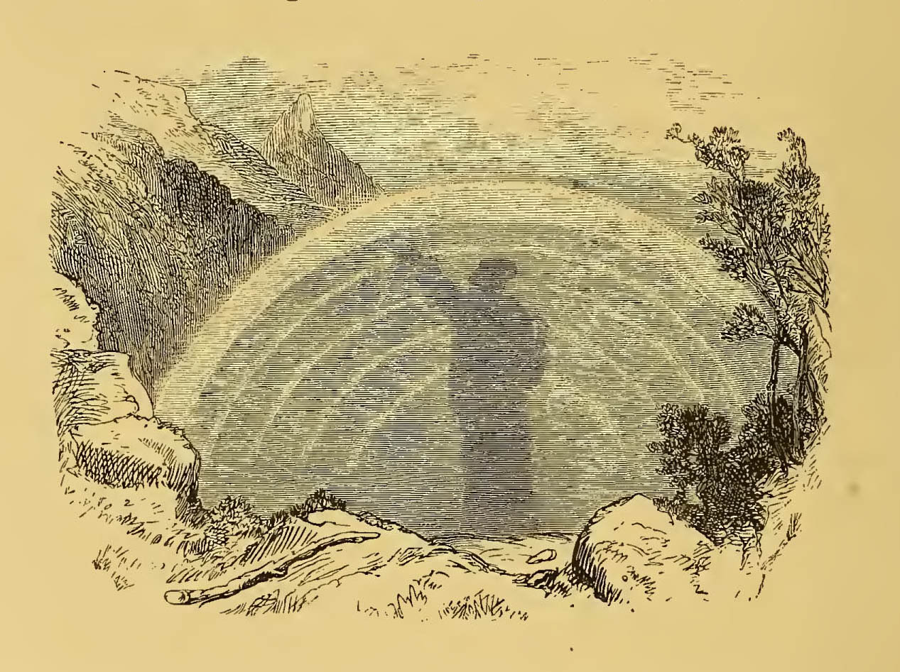 misty figure standing in a sunbow