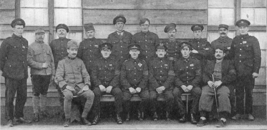Men in uniform sitting for a group portrait.