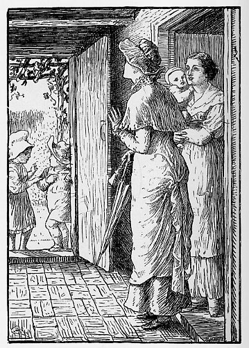 two woman, one with a baby, standing inside a house while two children stand in open doorway