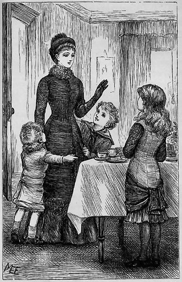 woman standing by table with girl and two boys