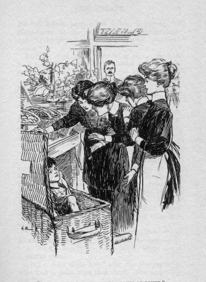 Dickie sitting up in the basket, as a woman holds the lid open and three others all look towards him. The store is spacious and filled with baskets of fruit.