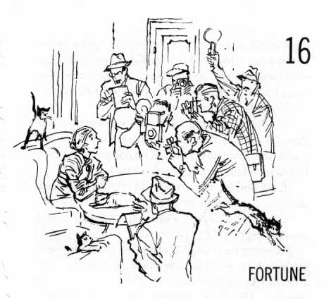 Chapter Sixteen: Fortune. Group of photographers and reporters standing around a woman seated at a table with two cats.
