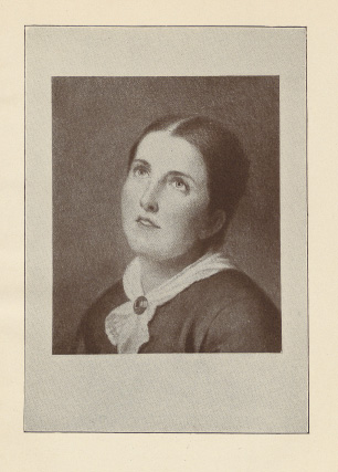 head and shoulders of young woman gazing soulfully upwards
