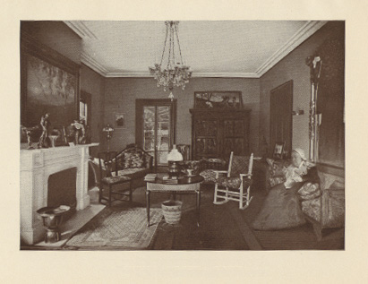 interior of parlor with fireplace and rocking chair