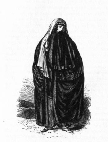 Woman wearing large robe and headcovering.