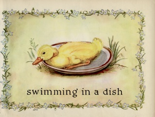 floral border around yellow duckling in a dish.