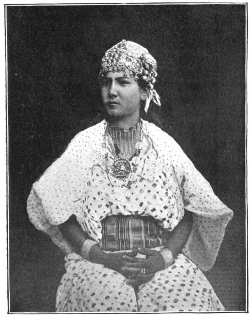 woman wearing elaborate outfit and headdress