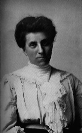 A woman in a ruffled blouse.