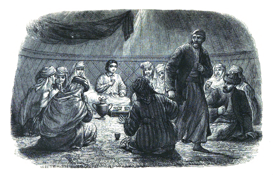 People seated in a circle on a carpet. The teapot and cups are on a tray in the center. One man has risen and appears to be checking on something.