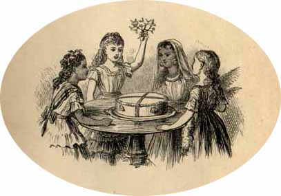 four nicely dressed girls seated at table with large cake one girl holds small branch over table 