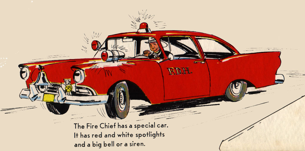 The Fire Chief driving a classic 1950s car with flashing red lights.