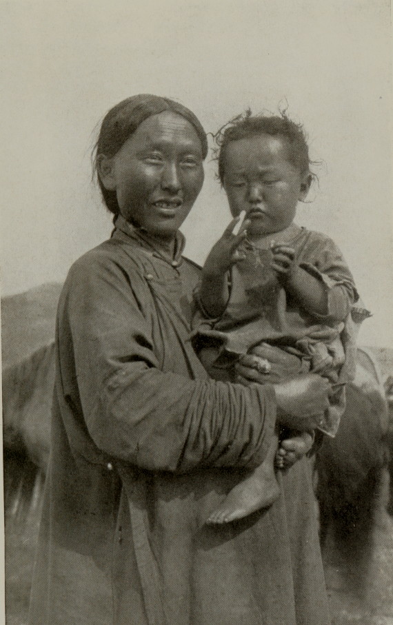 woman holding a young boy