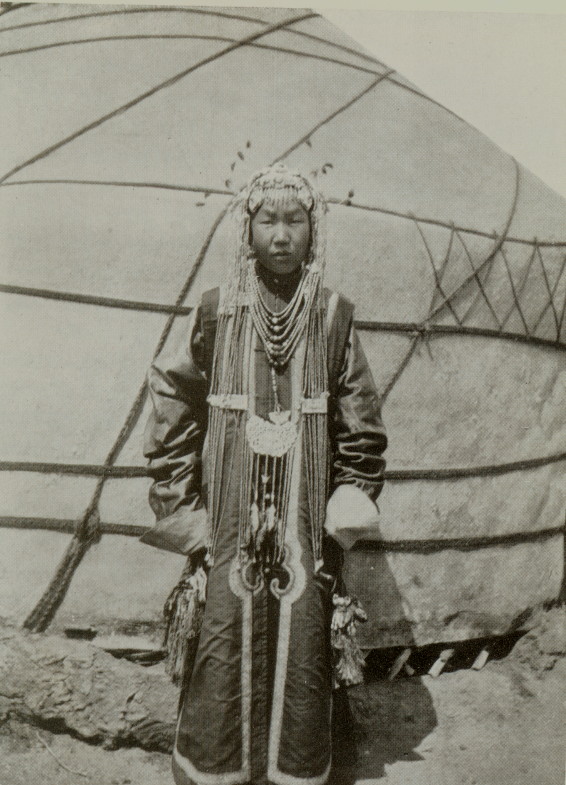 young Mongolian woman wearing an intricate bridal outfit and headdress