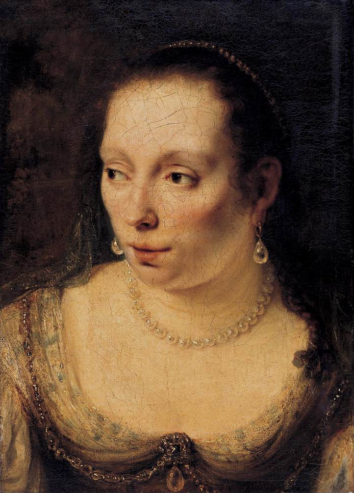 women with pearl necklace and earrings wearing fine clothing