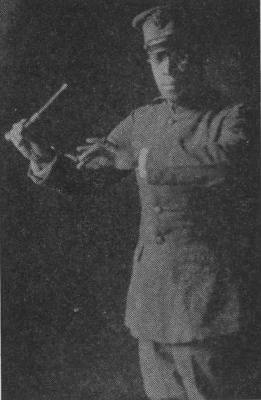 photograph of James Reese Europe,  in uniform holding a conductor's baton
