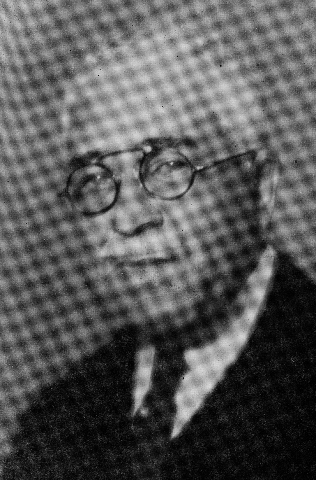 portrait of Harry T. Burleigh with glasses on