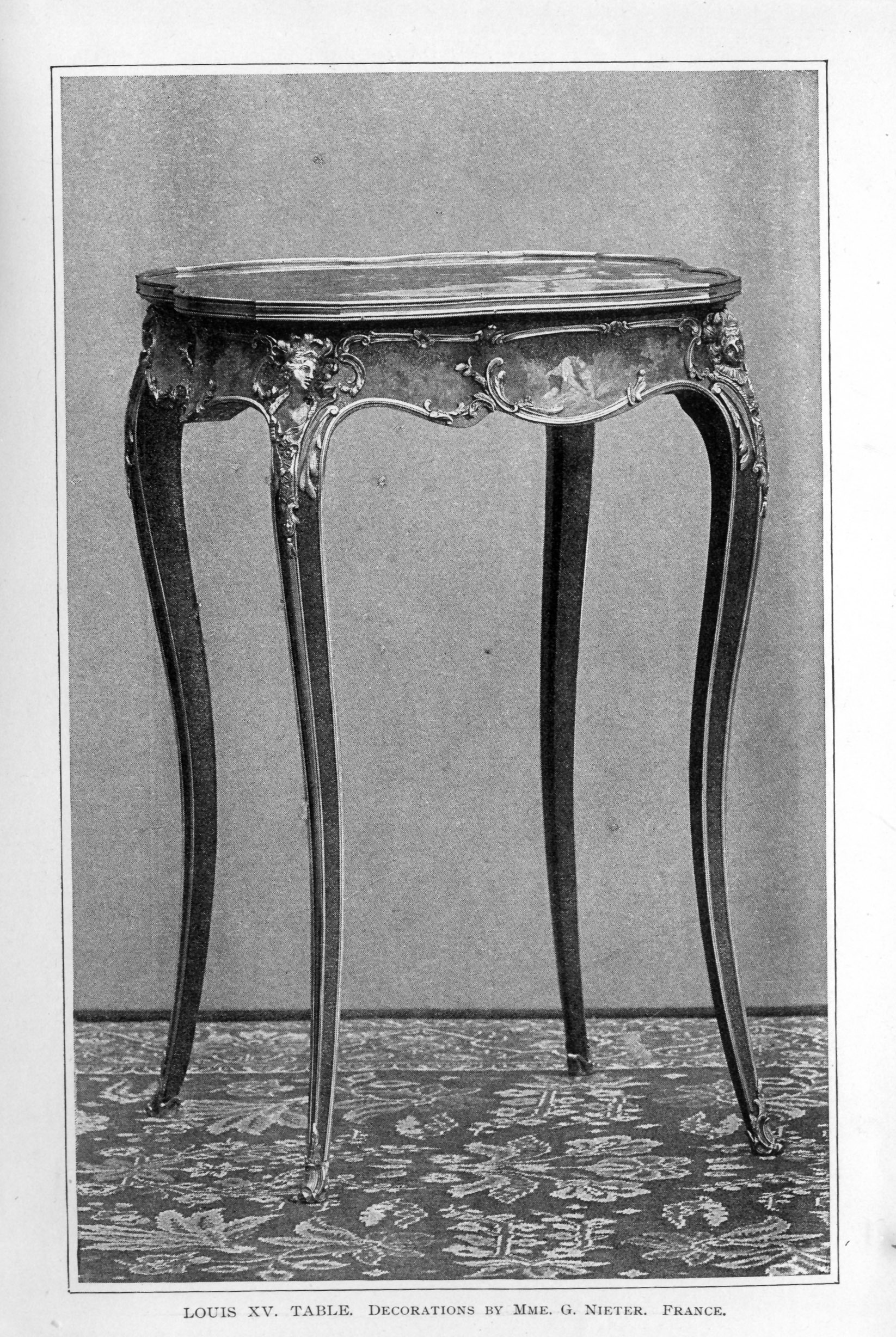 long-legged decorative table with gilded accents