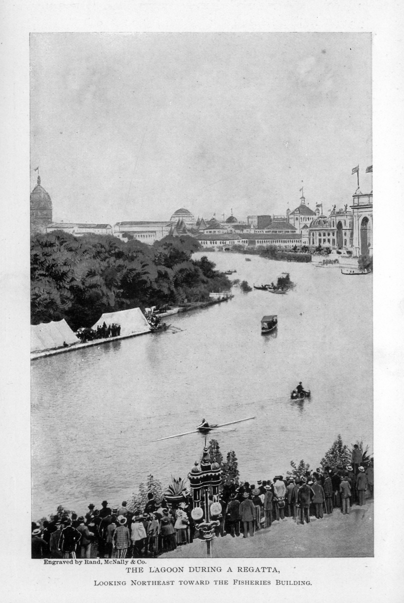 several small boats on the water, crowd of onlookers on the shore