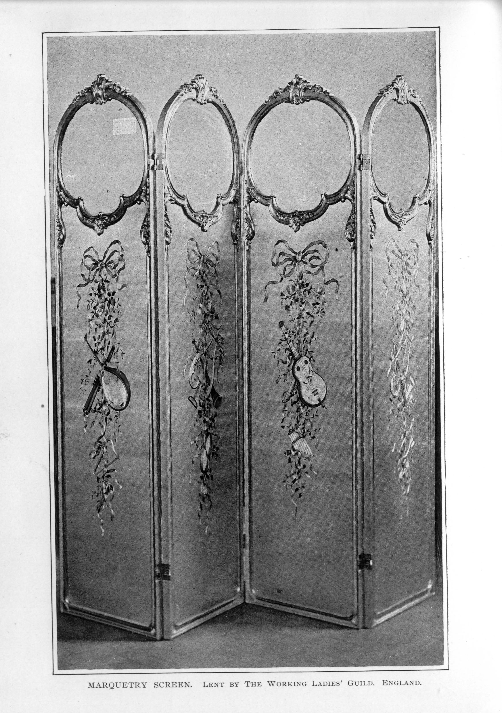 four panel screen decorated with ribbons, scrolling leaves, and central musical instrument on each panel