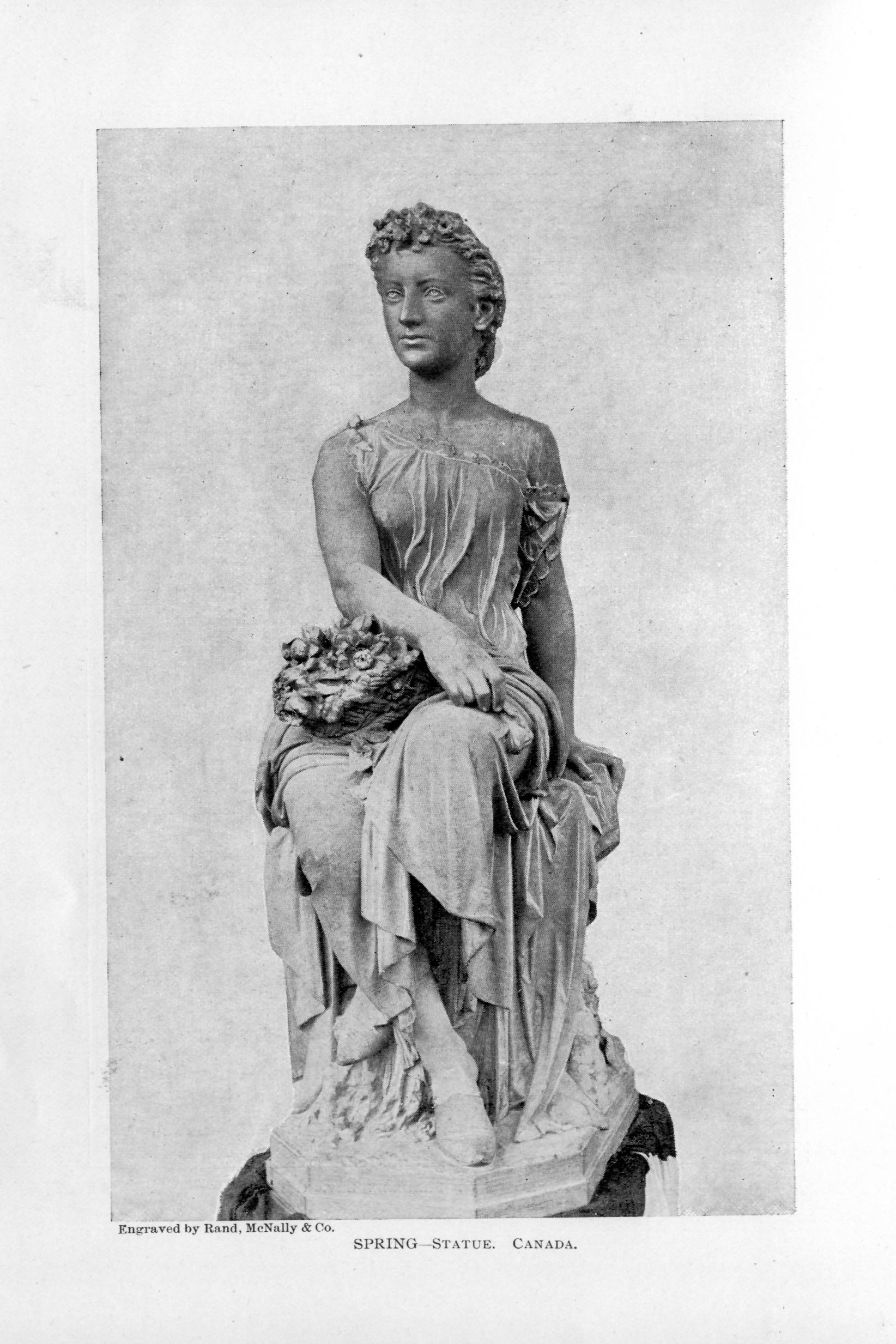 statue of a young robed woman sitting with a basket on her lap