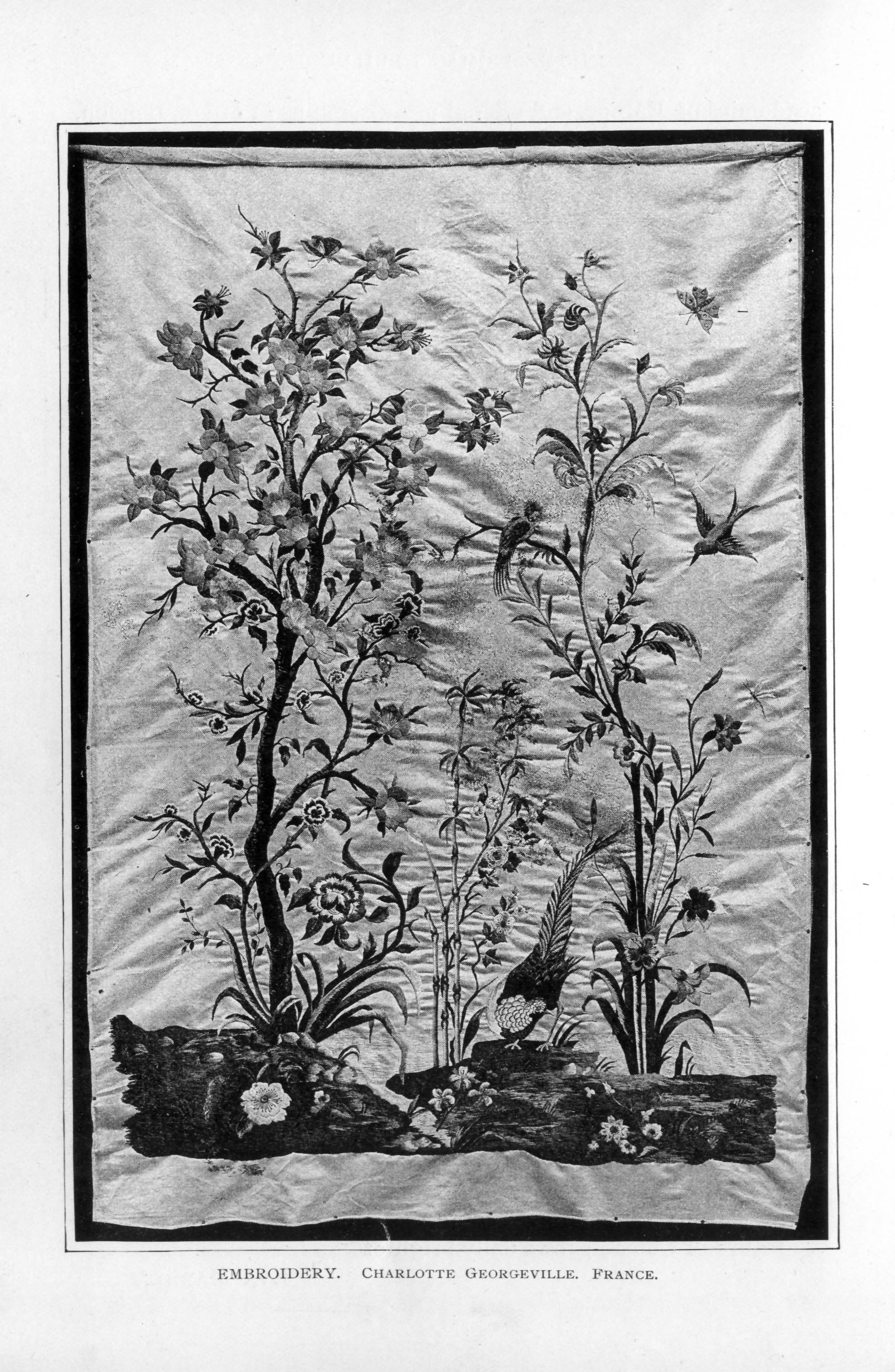 embroidered scene with flowers and birds