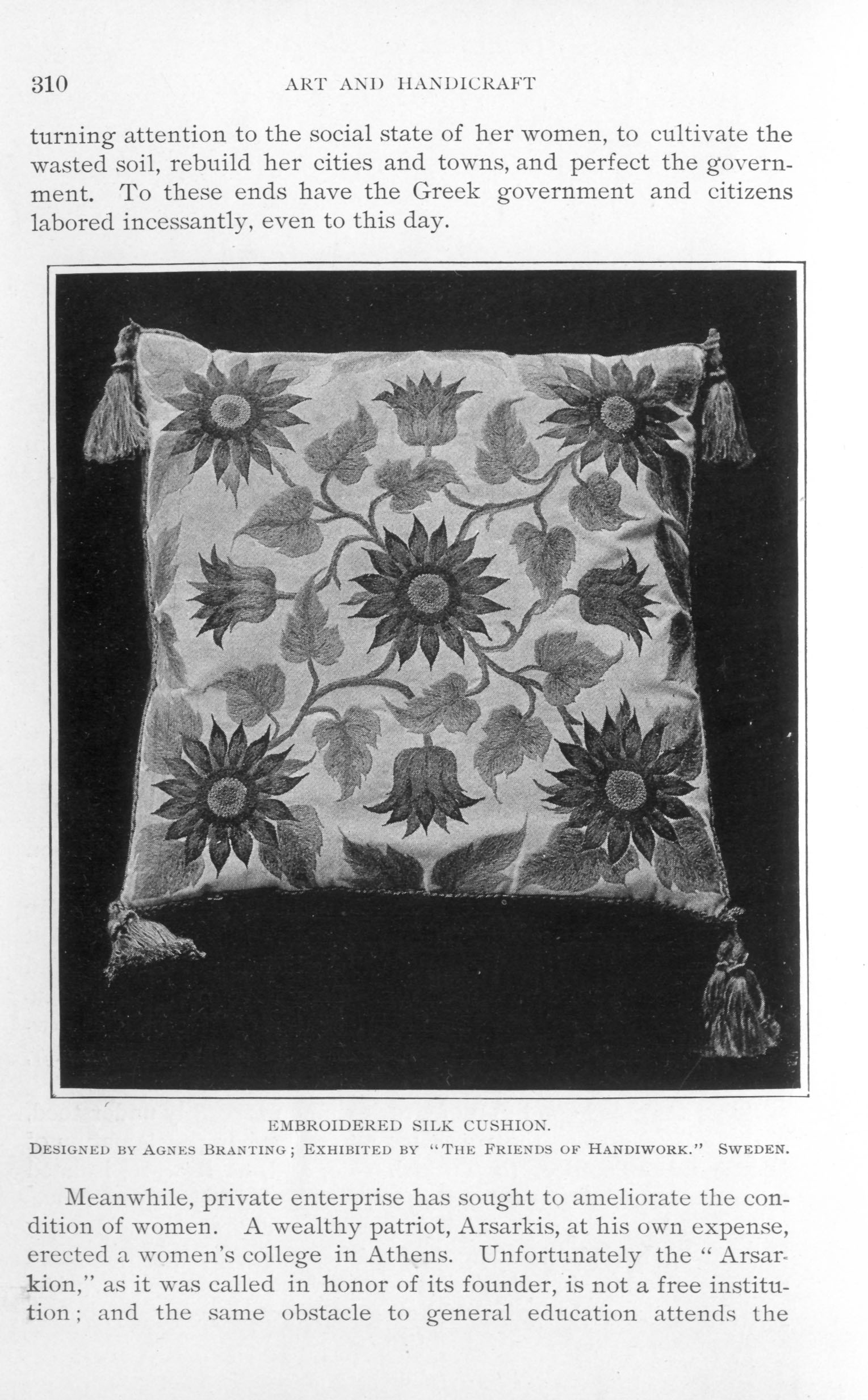 cushion decorated with floral embroidery and tassels