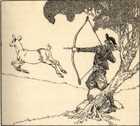 A hunter stands under a tree shooting at a deer.