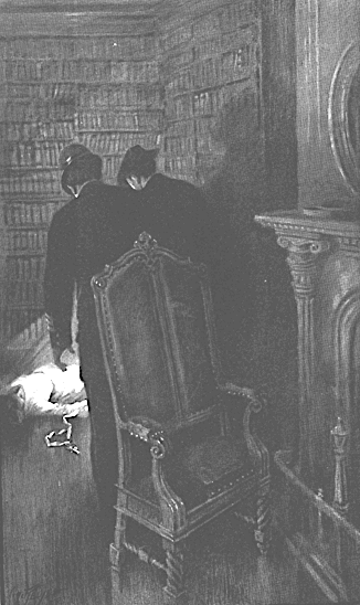 Very dark image of two men in a dark book filled room hovering over something in white cloth.