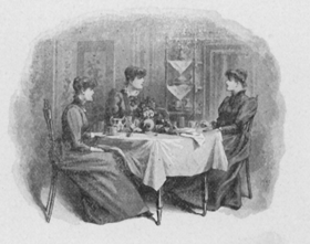 Three women seated at a table.