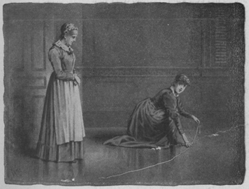 Woman kneeling to measure floor, while a second woman stands by her talking.