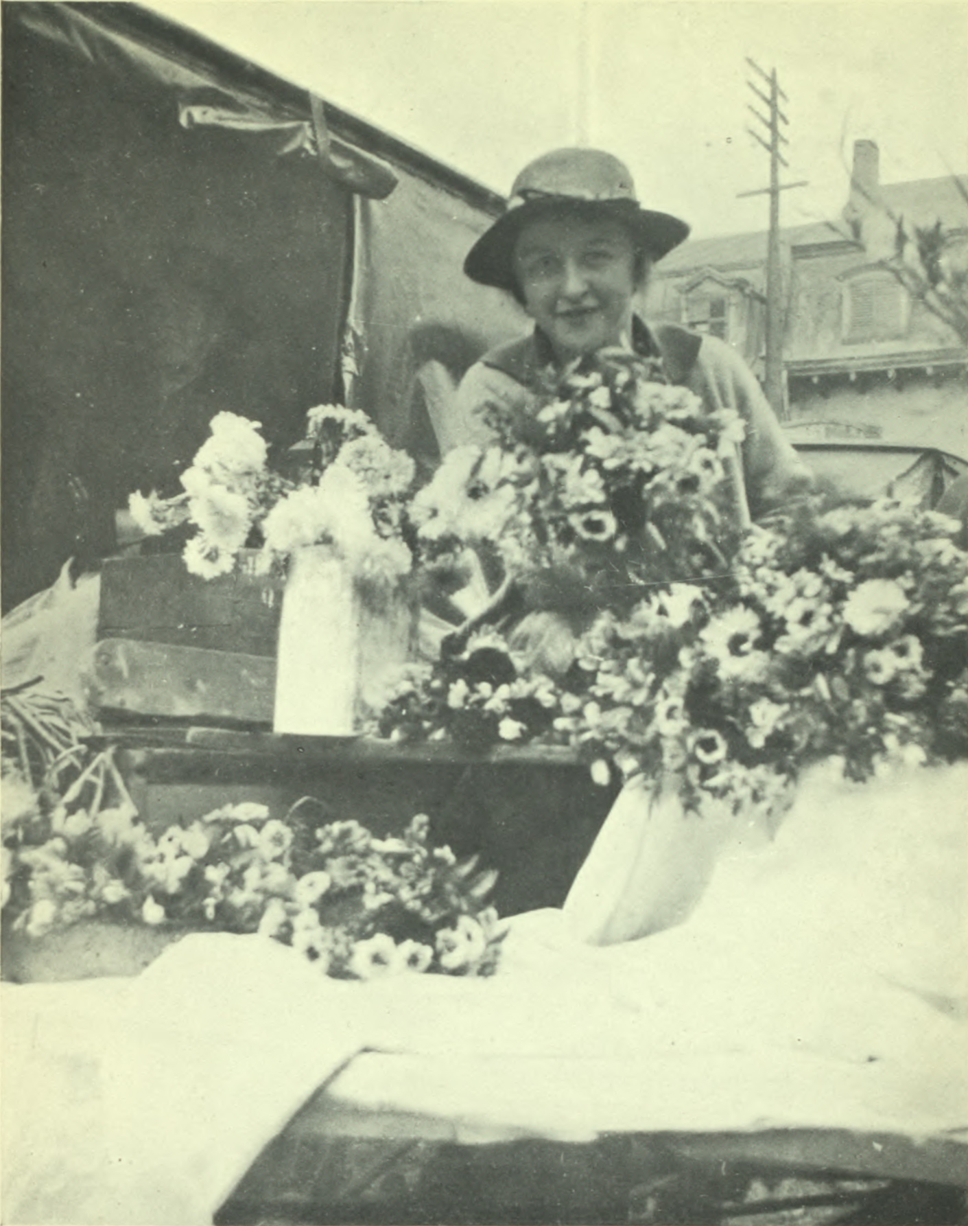 Woman selling flowers at the market.